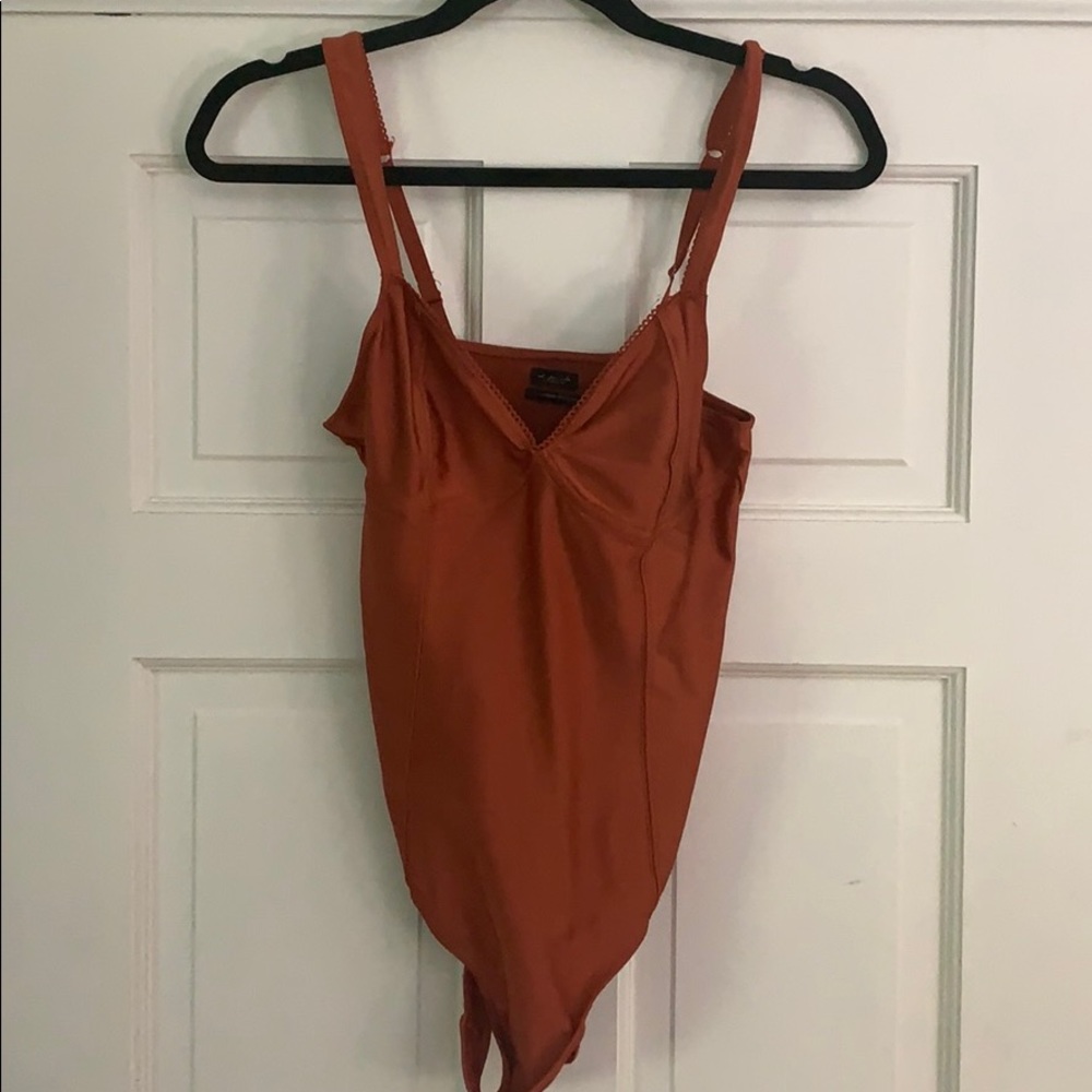 orange bodysuit